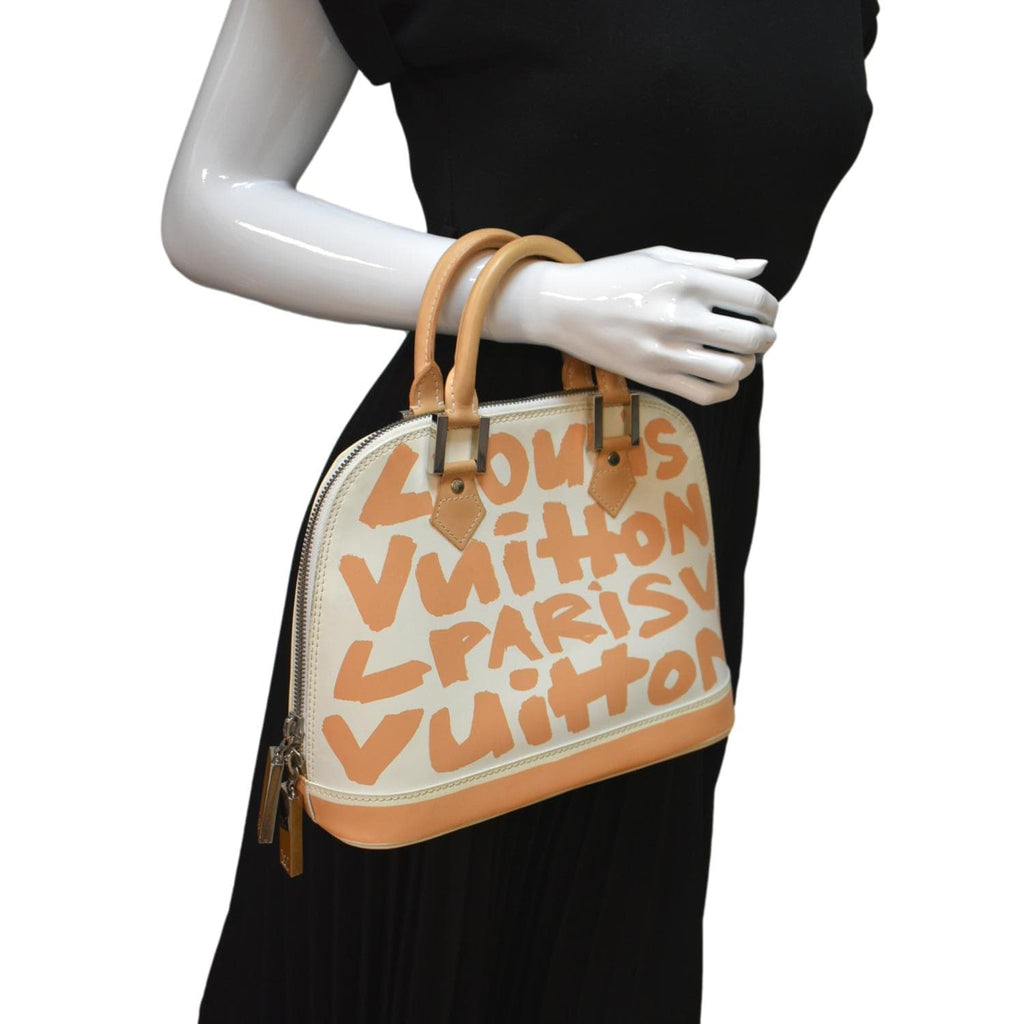 Alma graffiti leather handbag Louis Vuitton Brown in Leather - 18556524