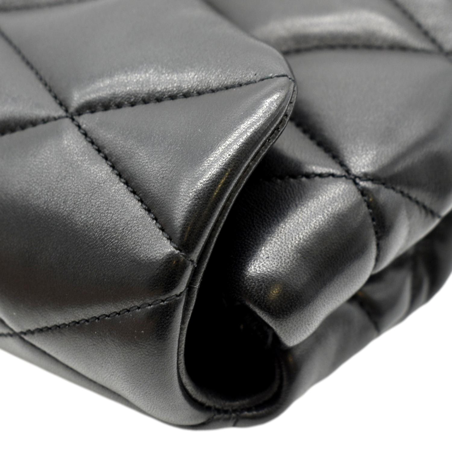 Quilted black leather clutch bag