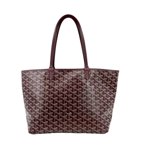 Amelie Mauresmo with the Goyard bag she designed during Auction of