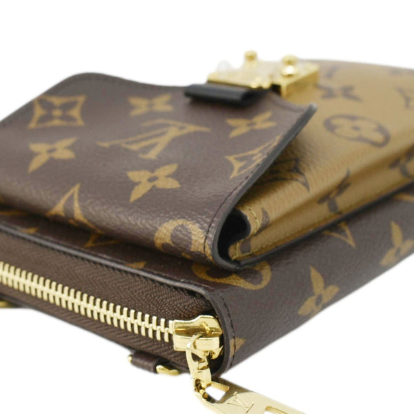 LOUIS VUITTON Metis Reverse Monogram Canvas Vertical Zippy Chain Wallet Brown