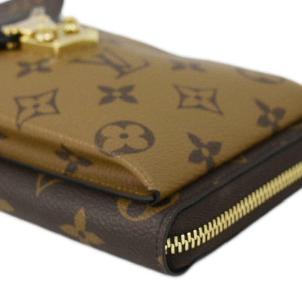 LOUIS VUITTON Metis Reverse Monogram Canvas Vertical Zippy Chain Wallet Brown