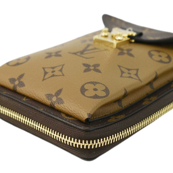 LOUIS VUITTON Metis Reverse Monogram Canvas Vertical Zippy Chain Wallet Brown