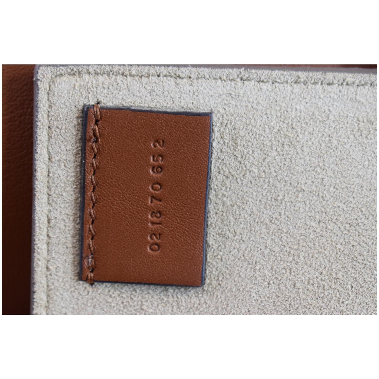 Brown Chloe Faye leather wallet in a strap