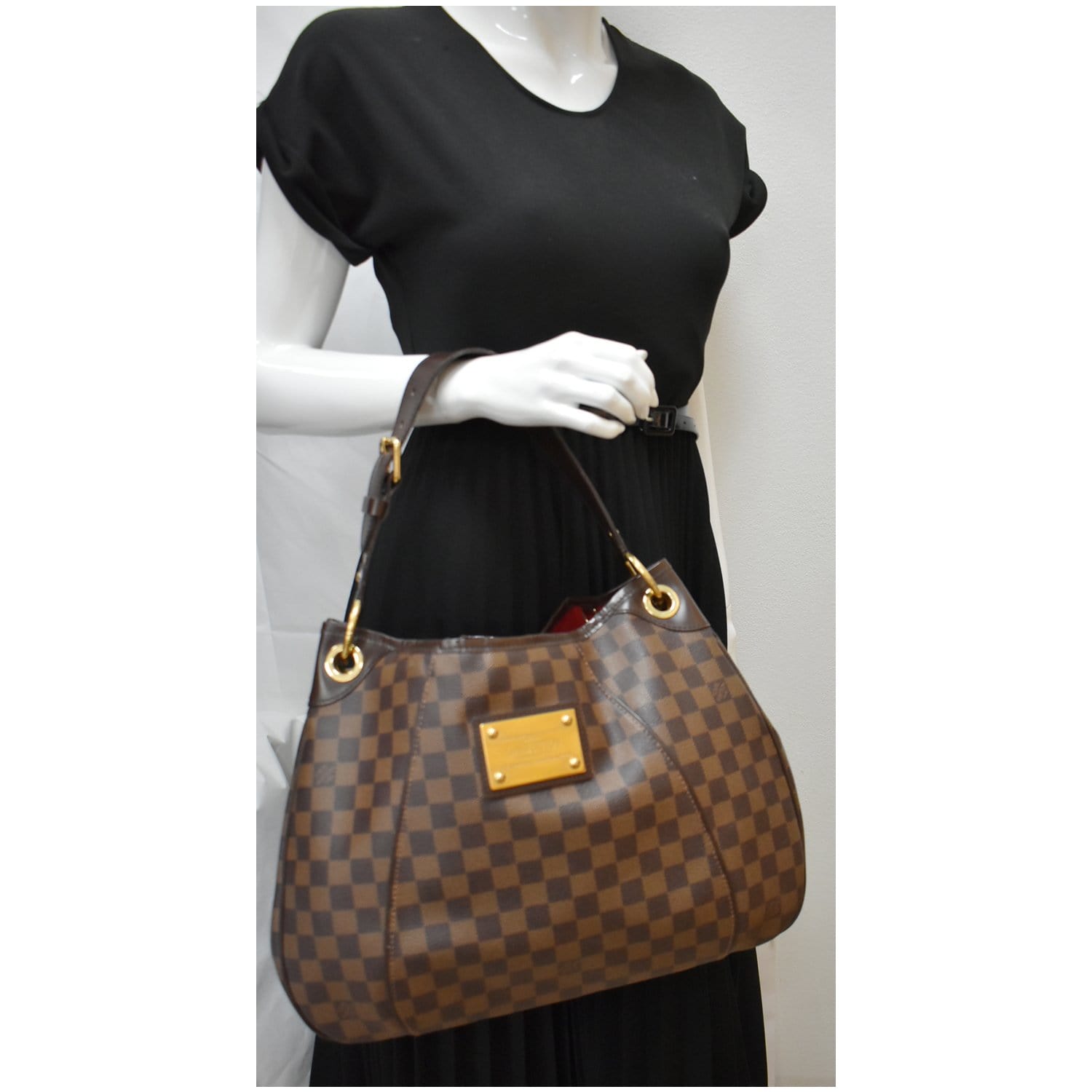 Woman with Brown Checkered Louis Vuitton Bag before Diesel Black
