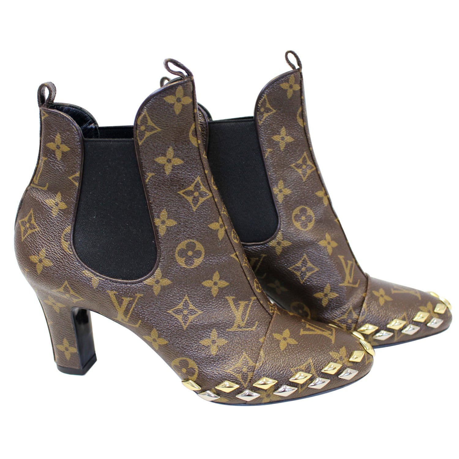 A pair of Louis Vuitton boots in monogrammed canvas with chocolate glace  leather heels and toes and gold tone hardware. Size 37 and come with dust  bag, cloth case and box. (1)