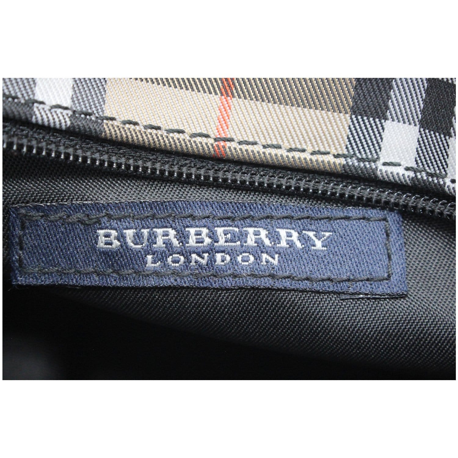 How do you tell if a Burberry bag is real or fake?