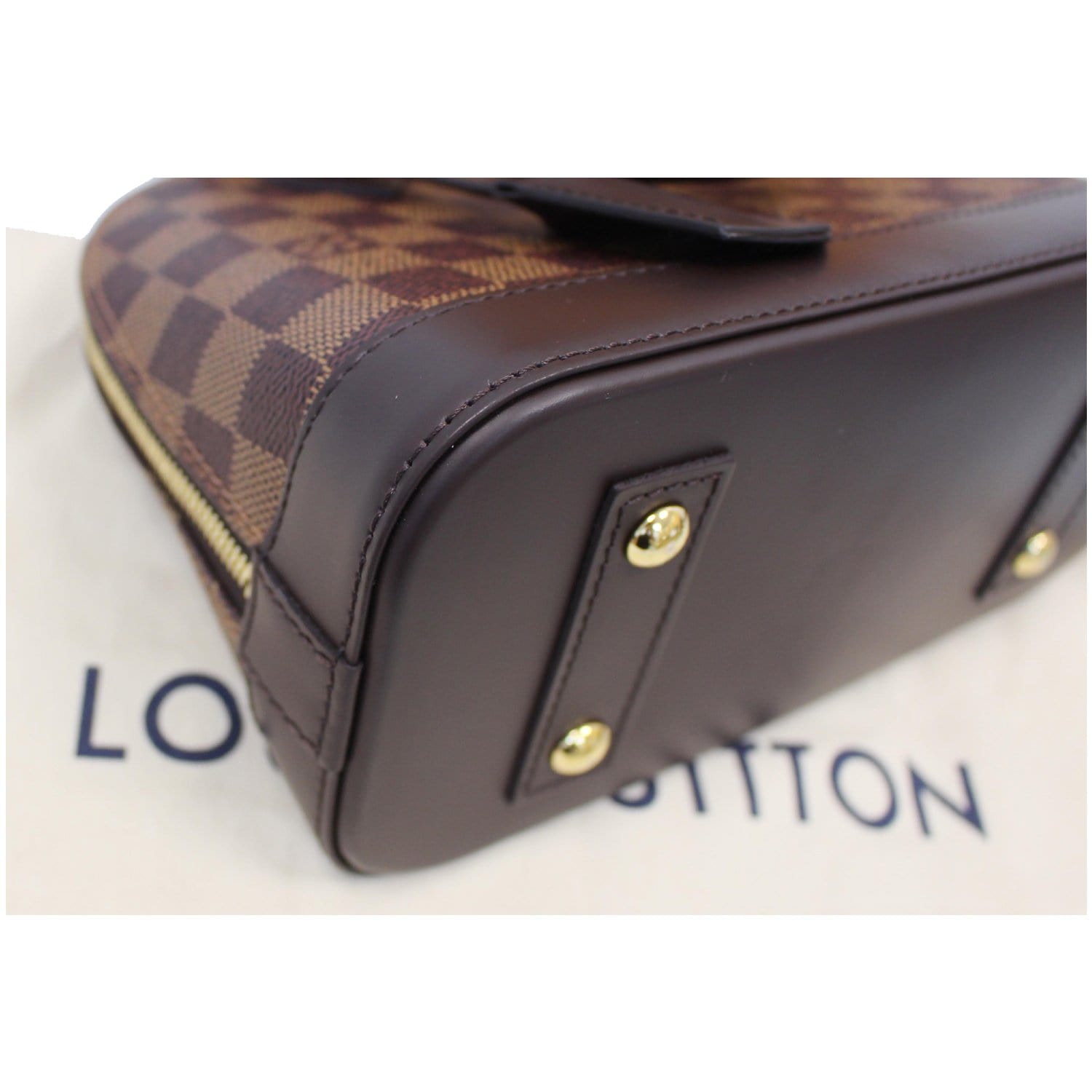 Louis Vuitton, Alma BB Damier plain, brown-checked rubbe…