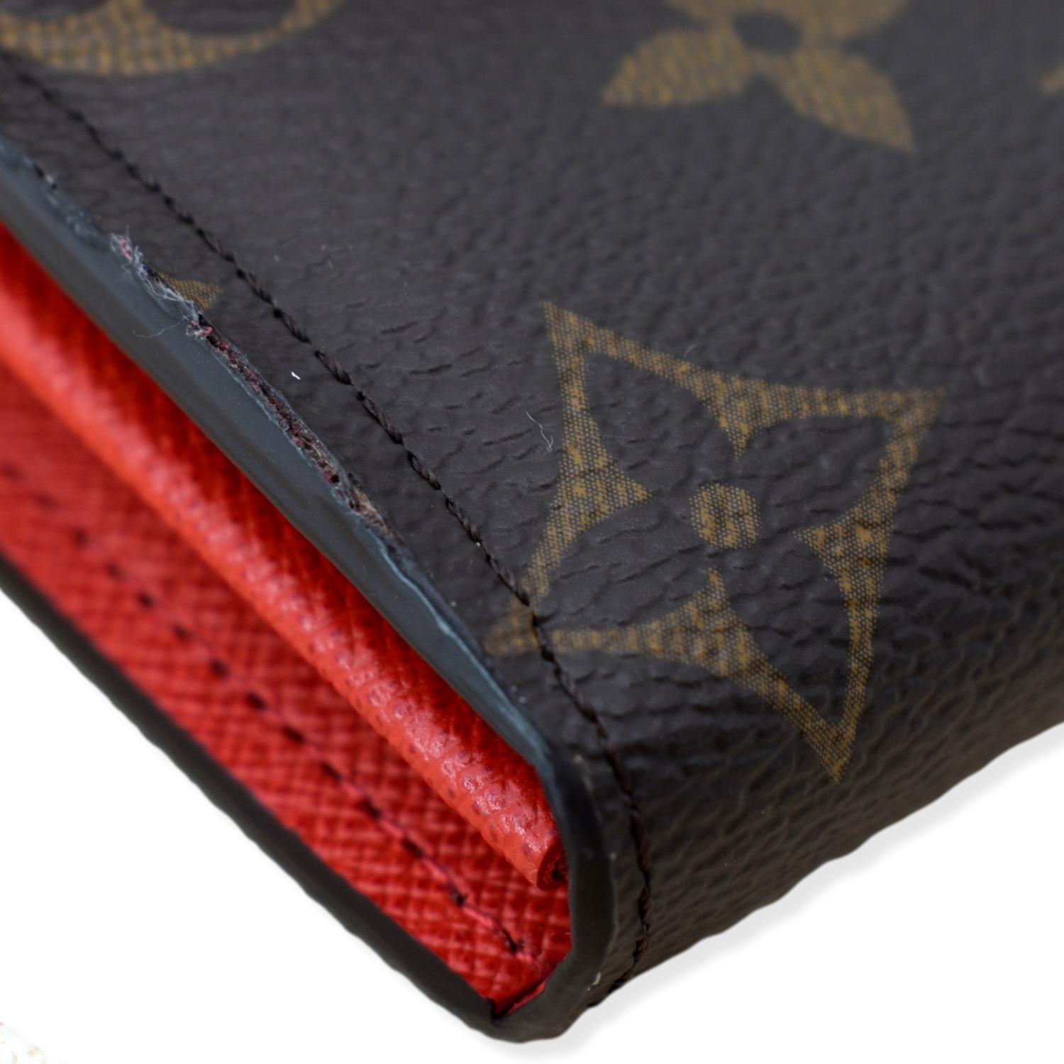 Louis Vuitton Sarah wallet with red interior. Gently