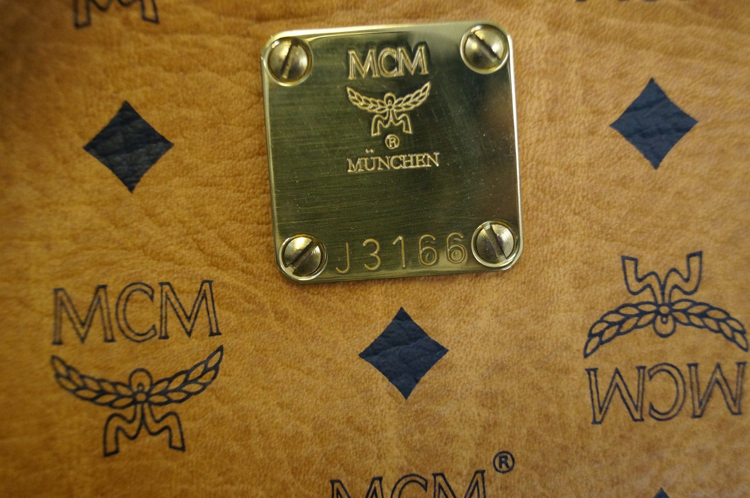 Sold at Auction: Lot of 3 vintage MCM Cognac Visetos Clutch Bag and Wallet