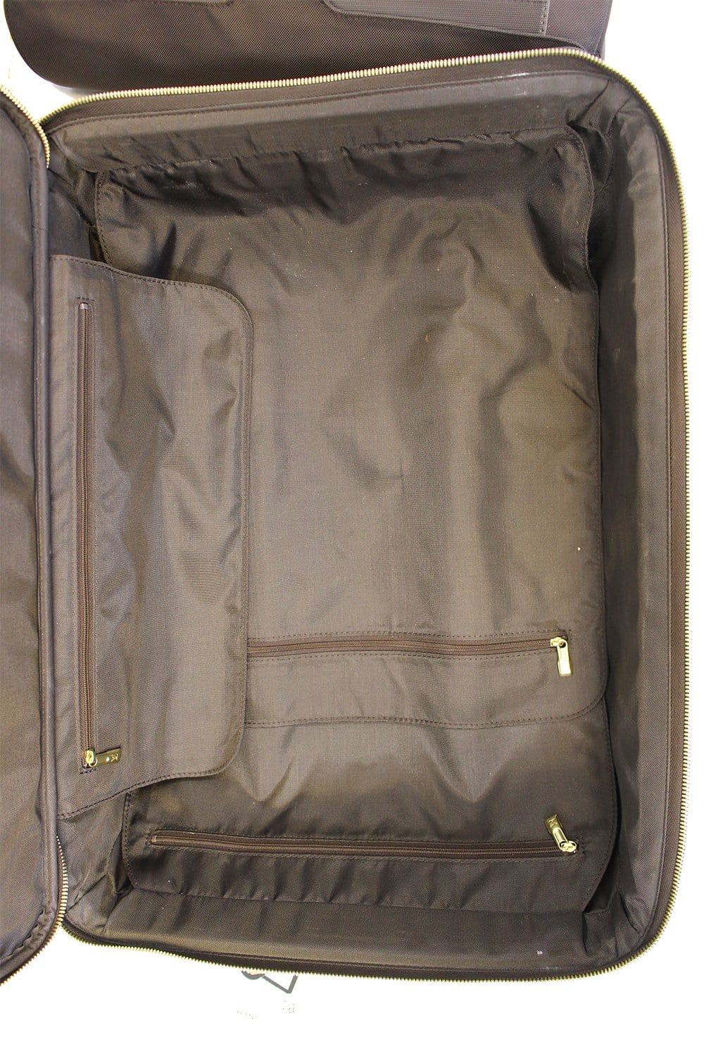 LOUIS VUITTON. Suitcase Pegase in monogrammed canvas a…
