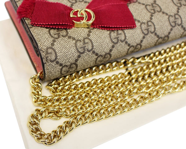 GUCCI Supreme Face-embellished GG Crossbody Bag