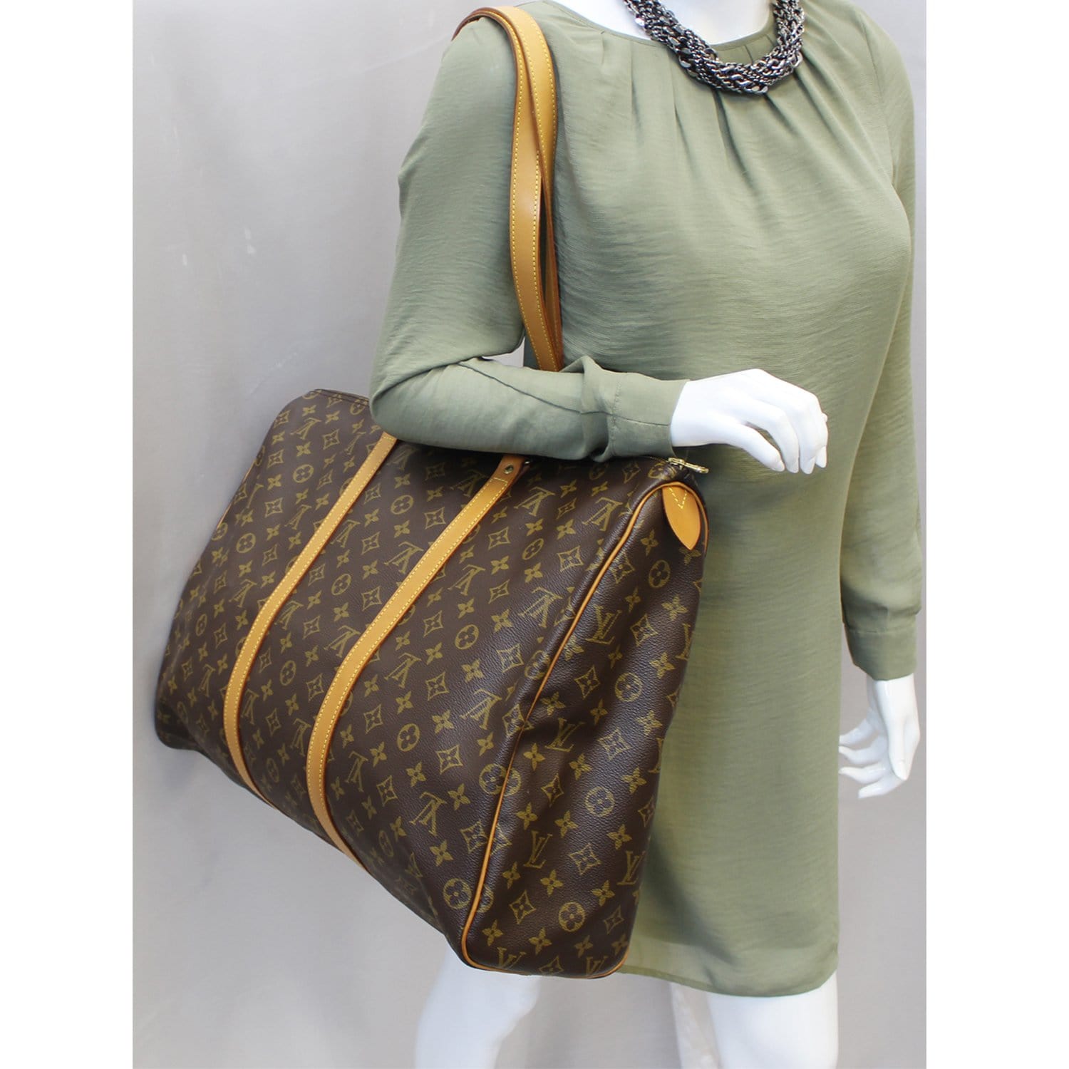 Louis Vuitton Flanerie in monogram canvas and natural leather